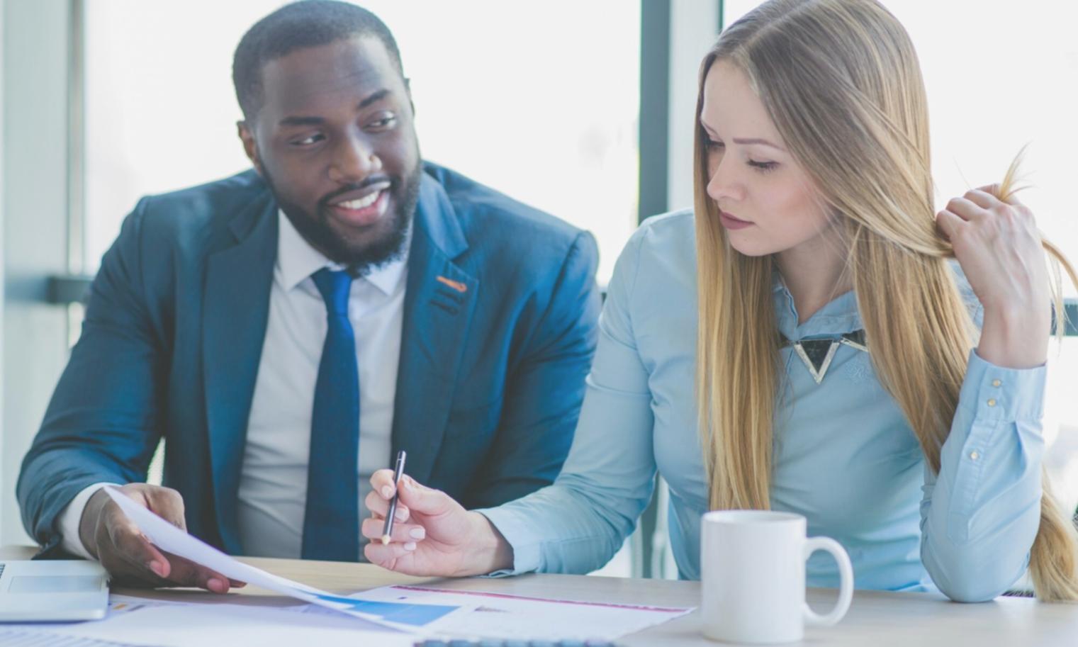 Business meeting with financial charts and graphs displayed on screen showing project analysis and results